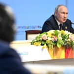 Vladimir Putin at a 2023 Russia-Africa summit in St. Petersburg, modified, http://en.kremlin.ru/events/president/news/71835