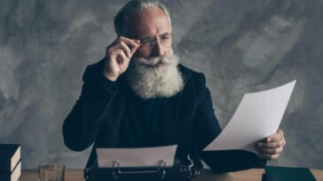 Professor Examining Paper