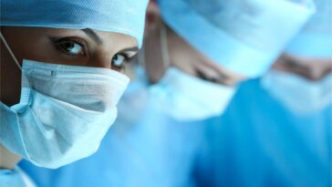 Female Surgeon Looking at Camera