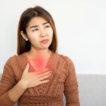 Asian Woman Heartburn