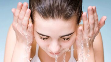 Young Woman Washing Face