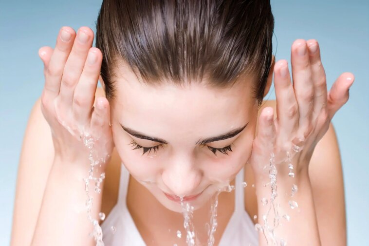 Young Woman Washing Face