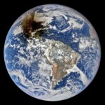 Earth Darkened by Moon