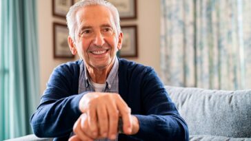 Happy Senior Man With Cane