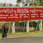 cc juls78, modified, https://commons.wikimedia.org/w/index.php?sort=last_edit_desc&search=Tatmadaw+filetype%3Abitmap&title=Special:Search&profile=advanced&fulltext=1&advancedSearch-current=%7B%22fields%22%3A%7B%22filetype%22%3A%22bitmap%22%7D%7D&ns0=1&ns6=1&ns12=1&ns14=1&ns100=1&ns106=1#/media/File:Propaganda,_Myanmar_2.jpg