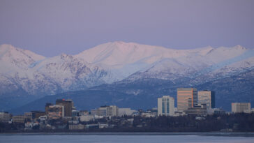 Anchorage, Alaska; cc James Brooks, modified, https://flickr.com/photos/jkbrooks85/50552723488/in/photolist-2k2aVsQ-p2vuwT-6PcyoD-36muQ-SXo144-6PgHNQ-2jRo12K-9JwJML-9KX6ge-9KX72P-aBq3XZ-4JqNbj-9KWwVk-9KX3La-9HZHEW-9HWDsx-KLHbum-6P4xjr-5AyzSH-dgdZmh-dwJhUo-9HYVdb-9KXdvH-9L11RC-9gPMz5-9HZ6NS-9JwHww-2mvwr78-BMcdY9-brhhaC-czJYi1-czJY1h-9JwMmS-9JwLu3-9JtW28-9JwM2L-9JwLaj-9JwKfq-oKhGvR-2mvr4Lg-9JtYFn-9JwLHS-9JtWr8-9JtVJv-oKhdNj-czJULs-BMcey7-czJXsq-dGfpsk-qa59VH