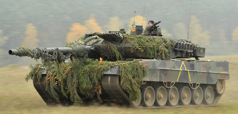 cc U.S. Army Europe photo by Visual Information Specialist Markus Rauchenberger, modified, A German Army Leopard II tank, assigned to 104th Panzer Battalion, moves through the Joint Multinational Readiness Center during Saber Junction 2012 in Hohenfels, Germany, Oct. 25. The U.S. Army Europe
