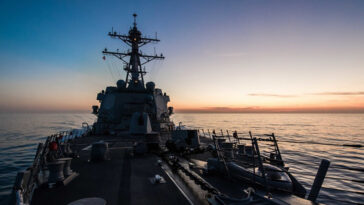 Ship moves through Strait of Gibraltor. The guided missile destroyer USS Jason Dunham transits the Strait of Gibraltar at dusk, June 14, 2018. The ship was conducting naval operations in the U.S. 6th Fleet area of operations in support of U.S. national security interests in Europe. During small-boat operations in the Red Sea, a sailor assigned to the ship died July 8, 2018. DoD photo by Navy Petty Officer 3rd Class Jonathan Clay