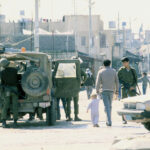 cc Efi Sharir / Dan Hadani collection / National Library of Israel / The Pritzker Family National Photography Collection, modified, https://commons.wikimedia.org/w/index.php?limit=500&offset=0&profile=default&search=Gaza&title=Special:Search&ns0=1&ns6=1&ns12=1&ns14=1&ns100=1&ns106=1#/media/File:Intifada_in_Gaza_Strip_(FL45954629).jpg