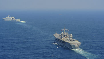 150424-N-NM917-049 SOUTH CHINA SEA (April 24, 2015) - The U.S. 7th Fleet flagship USS Blue Ridge (LCC 19), and CNS Qilianshan (LPD 999) of the People