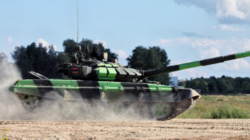 cc Vitaly V. Kuzmin , modified, https://commons.wikimedia.org/w/index.php?sort=last_edit_desc&search=armenia+tank+filetype%3Abitmap&title=Special%3ASearch&profile=advanced&fulltext=1&advancedSearch-current=%7B%22fields%22%3A%7B%22filetype%22%3A%22bitmap%22%7D%7D&ns0=1&ns6=1&ns12=1&ns14=1&ns100=1&ns106=1#/media/File:TankBiathlon2016opening-30.jpg