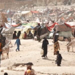 cc Henry Wilkins VOA, modified, https://en.wikipedia.org/wiki/Sudanese_civil_war_(2023%E2%80%93present)#/media/File:Screengrab_of_refugee_camp_from_Number_of_Refugees_Who_Fled_Sudan_for_Chad_Double_in_Week.jpg