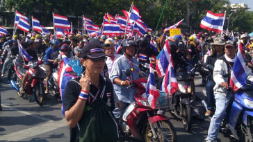 cc ilf_, modified, wikicommons. Anti-government protesters in Bangkok, on motorcycles while mobilizing to surround government offices, 1 December 2013 - the crisis that resulted in the removal of Yingluck Shinawatra.