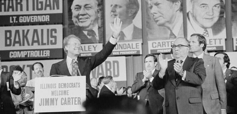 public domain, Library of Congress, modified, https://commons.wikimedia.org/w/index.php?search=jimmy%20carter%20election&ns0=1&ns6=1&ns12=1&ns14=1&ns100=1&ns106=1#/media/File:Jimmy_Carter_and_Mayor_Richard_J._Daley_at_the_Illinois_State_Democratic_Convention_in_Chicago,_Illinois.jpg / Thomas J. O