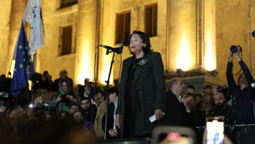 cc The Administration of the President of Georgia, modified, https://commons.wikimedia.org/w/index.php?sort=last_edit_desc&search=georgia+election+protest+filetype%3Abitmap&title=Special:Search&profile=advanced&fulltext=1&advancedSearch-current=%7B%22fields%22%3A%7B%22filetype%22%3A%22bitmap%22%7D%7D&ns0=1&ns6=1&ns12=1&ns14=1&ns100=1&ns106=1#/media/File:Salome_Zourabichvili_28-Oct-2024.jpg