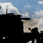 A British soldier fires a 40mm grenade machine gun at the Bemowo Piskie Training Area, Bemowo Piskie, in Poland, on June 8, 2017. Saber Strike 17 is a U.S. Army Europe-led multinational combined forces exercise conducted annually to enhance the NATO alliance throughout the Baltic region and Poland. This year