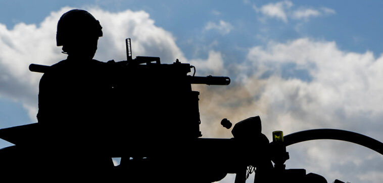A British soldier fires a 40mm grenade machine gun at the Bemowo Piskie Training Area, Bemowo Piskie, in Poland, on June 8, 2017. Saber Strike 17 is a U.S. Army Europe-led multinational combined forces exercise conducted annually to enhance the NATO alliance throughout the Baltic region and Poland. This year