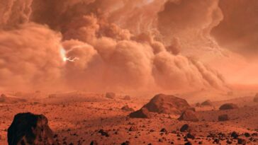 A vast dust storm appears over the rim of a crater on Mars