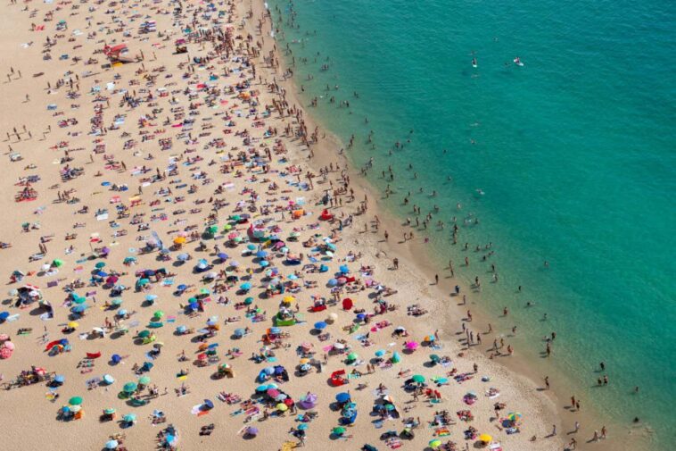 Aerial view of a crowded beach from above, praia de Nazar?, Portugal, Europe; Shutterstock ID 2189816843; purchase_order: -; job: -; client: -; other: -