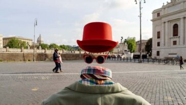 RC9MHB Rome, Italy, 05/06/2018: a street artist simulates an invisible man on the pedestrian area along tevere castello near castel sant