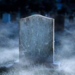 Creepy blank gravestone in graveyard at night with low spooky fog; Shutterstock ID 1890736525; purchase_order: -; job: -; client: -; other: -