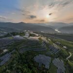 TOPSHOT - This photo taken on August 16, 2022 shows solar panels among Sichuan pepper field in Bijie, in China
