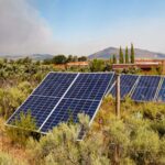 Solar panels installed in wild brush land near Worcester, Western Cape, South Africa.