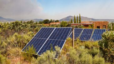 Solar panels installed in wild brush land near Worcester, Western Cape, South Africa.