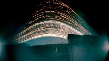 Janette Kerr PPRWA Hon. RSA, Twenty Solargraphs from the Solargraphic Project 2020-24 Formless 2024-25 (exposure time 18 months) Solargraph on paper Kerr collaborated with communities in Iceland, Greenland, Shetland and Somerset, to record the slow passage of time in different landscapes. The solargraphic process is a form of long-exposure photography. Kerr captures the arc of the Sun, as it moves across the sky from dawn to dusk, on photographic paper sealed in DIY pinhole cameras made from drinks cans. Her approach combines science and art, chemistry and the digital processing of the final image. Slow Time. The Sun rises and falls each day, its gradual trek discreetly recorded by small tin cans whose uninterrupted gaze captures every photon of sunlight travelling across the sky. Solargraphy (from the Latin solar, of the sun, and graphia, writing) is a form of long-exposure photography that captures the Sun moving across the sky. It combines science and art, chemistry and [today] digital elements. Being able to capture an extended period of time in a single frame, far beyond the capacity of the human eye, is incredible enough, but even more amazing is how simple it is. A low-tech process, solargraphy typically uses pinhole cameras made from used drinks cans. Sheets of black-and-white photographic paper can be sealed inside the cans, and then the cameras are fixed outdoors, facing south [in the Northern Hemisphere]. We usually think of photography as an instant process, images captured digitally in a fraction of a second. Solargraphs by Kerr have been recorded over a period of 1?18 months, mapping landscape in slow time. Light waves are captured as they travel through the air, passing through a pinhole in the side of the can and slowly etching an image on photographic paper curved around the inside. The resulting images are shaped by landscape and the Sun?s daily elevation. Actions of the environment ? rain and other elemental detritus, or the can?s unexpected movement ? also leave traces on the final pictures, yet moving objects leave no trace. Solargraphy is a ?printing-out? process: this is where an image forms on photographic paper solely through the action of light, without using chemicals to develop the image. Light provides the energy required for silver halides (salts) in the photographic paper to change to a visible state. When silver halides are exposed to light, free metallic silver atoms are ?liberated?, forming a latent image. Over a prolonged exposure of several months the silver halide particles clump together, increasing in size. The photographic paper slowly becomes coloured, transitioning from yellow to sepia and then pink, even slate grey. (In traditional photography, the latent image would be chemically developed in a darkroom.) For contemporary solargraphy, the image captured on the paper can be scanned and manipulated, using a photo-editing program on a laptop, to form a digital record. A solargraphic project was initiated by Kerr during various residencies, and in collaboration with communities in Iceland, Greenland, Shetland and Somerset. The final images that she produces show the Sun?s progress as an accumulation of arcing and streaking lines, leaving ghostly exposures of landscape seen in slow time, out of phase with human activity. w3w: ///reporters.survived.formless (Coleford, Somerset) 2024?5 Solargraph on paper (exposure time: 18 months) 21 x 30cm COURTESY OF THE ARTIST