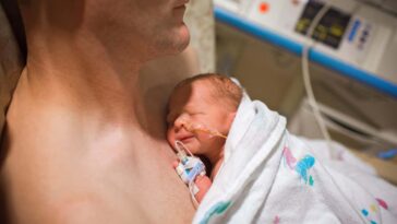 TTT8PK Cute girl eating sweet food while sitting at restaurant