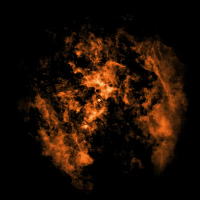 Des nuages ​​de gaz orange forment un cercle, sauf en bas où se trouve un vide en forme de cône, preuve du vent soufflant du trou noir central de la Voie lactée, selon les chercheurs.