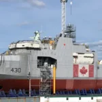HMCS Harry DeWolf, lead vessel in class, under construction in the Halifax Shipyard, May 2018. Photo by WayeMason, CC BY-SA 4.0, modified, https://commons.wikimedia.org/wiki/File:HMCS_Harry_Dewolf_under_construction_May_2018.jpg