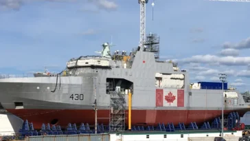 HMCS Harry DeWolf, lead vessel in class, under construction in the Halifax Shipyard, May 2018. Photo by WayeMason, CC BY-SA 4.0, modified, https://commons.wikimedia.org/wiki/File:HMCS_Harry_Dewolf_under_construction_May_2018.jpg