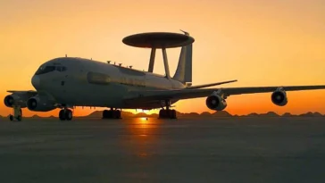 The E-3 Sentry is a modified Boeing 707/320 commercial airframe with a rotating radar dome. The dome is 30 feet in diameter, 6 feet thick and is held 11 feet above the fuselage by two struts. It contains a radar subsystem that permits surveillance from the Earth