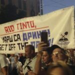 Protesters carry a
