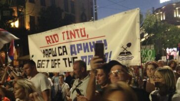 Protesters carry a