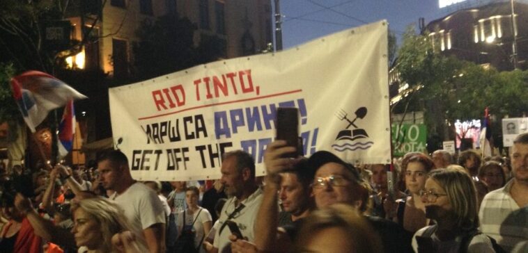 Protesters carry a