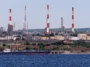 The Saratov Oil Refinery seen across the Volga River, Saratov, Russia (Photo by Alexxx1979), CC BY-SA 4.0, modified, https://commons.wikimedia.org/wiki/File:Volga_river._Saratov_Oil_Refinery_P8090744_2200.jpg